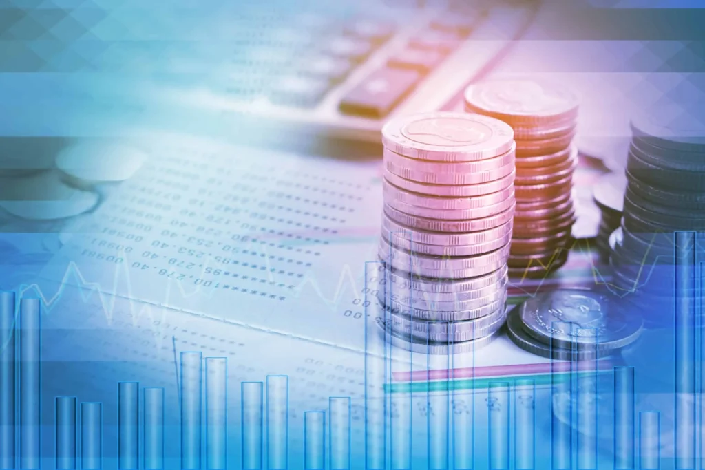 double exposure pile of coins,financial graph,stock chart, account book and calculator in background